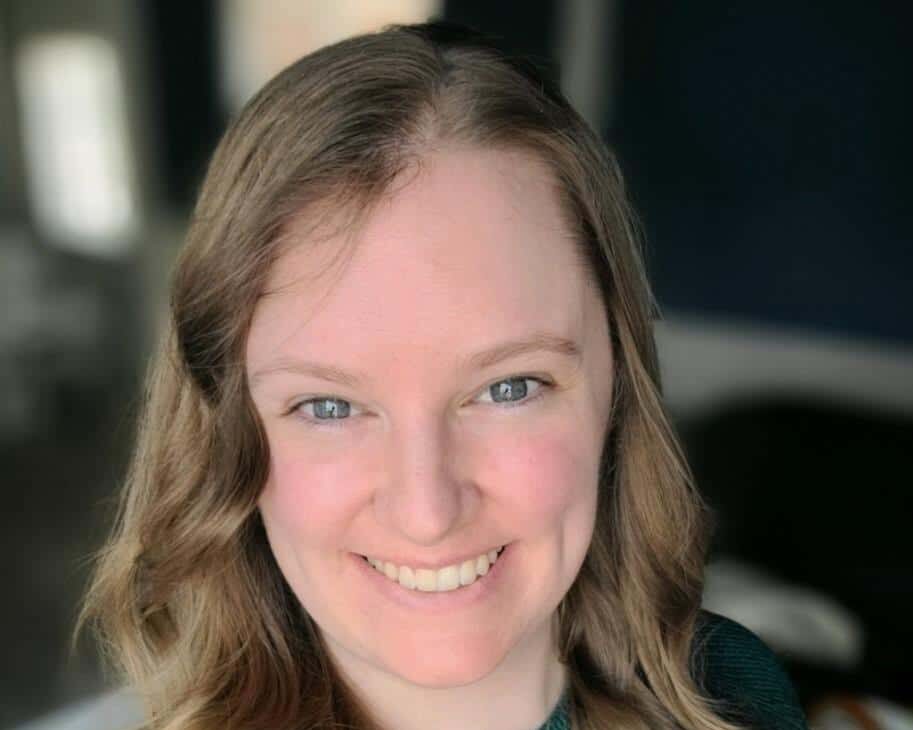 Dani Cox Headshot of Dani in a green long sleeved-shirt